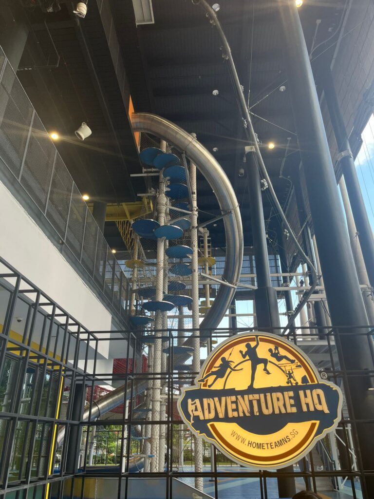 Adventure HQ sign and surroundings climbing net slides and climbing walls. singapore date night.